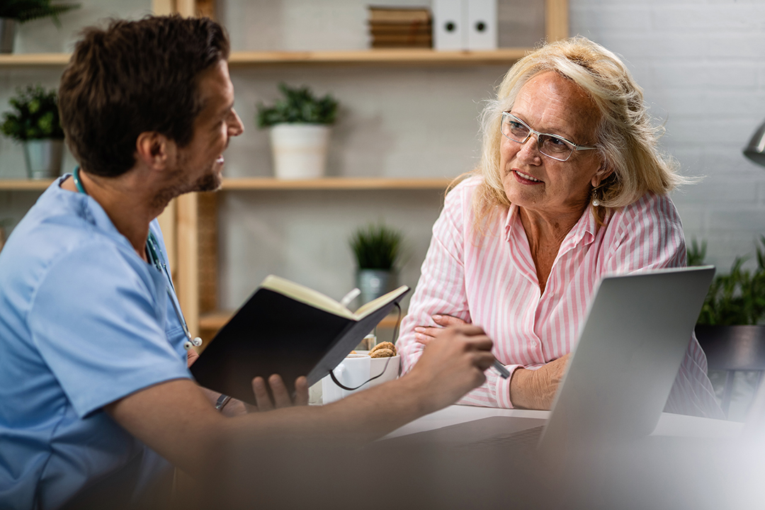 smiling-senior-woman-talking-her-doctor-medical-appointment-his-office